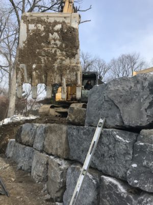 Excavating services with heavy machinery at a Vermont construction site.