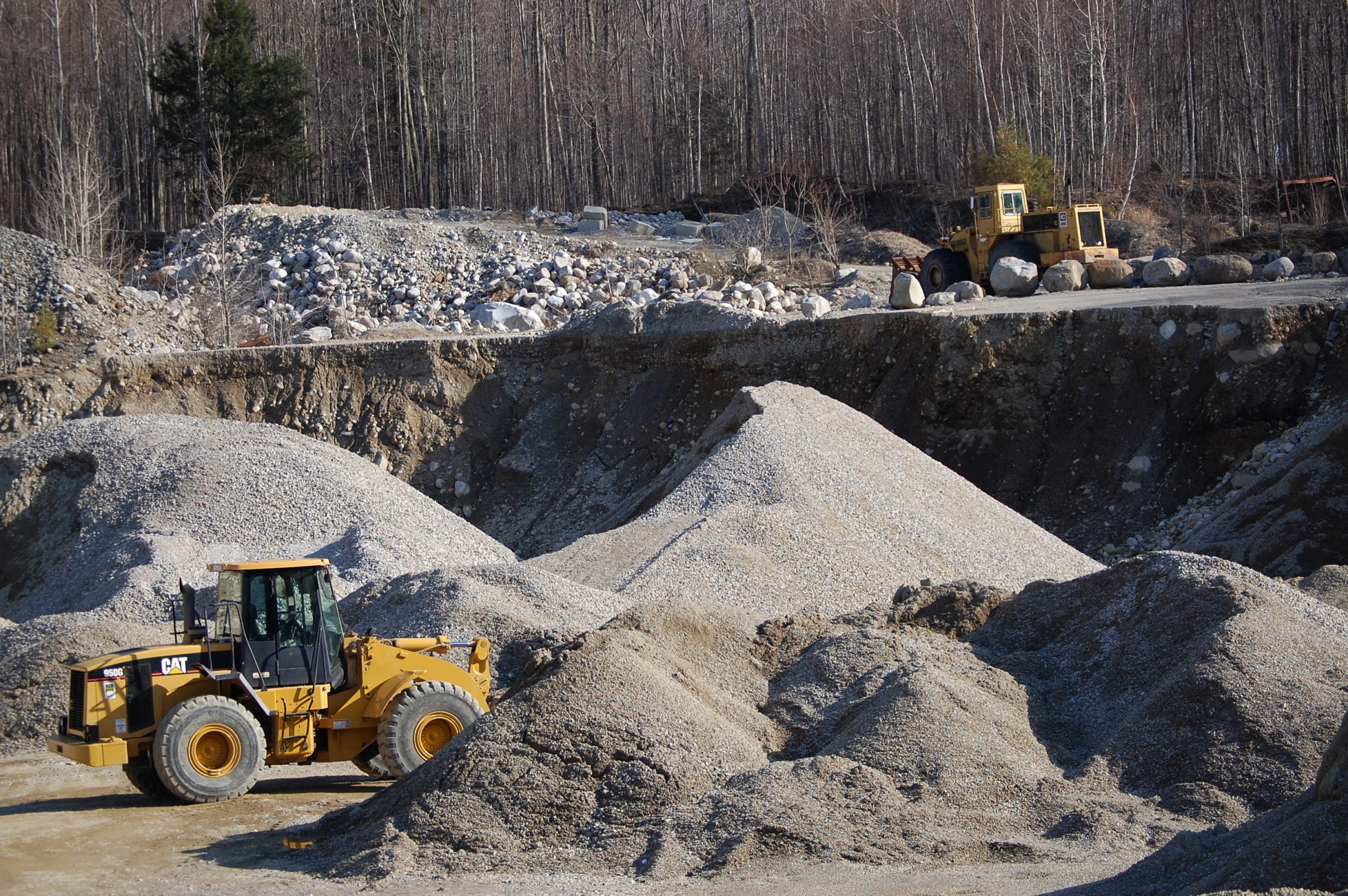 Excavating services with heavy machinery in a Vermont gravel pit.